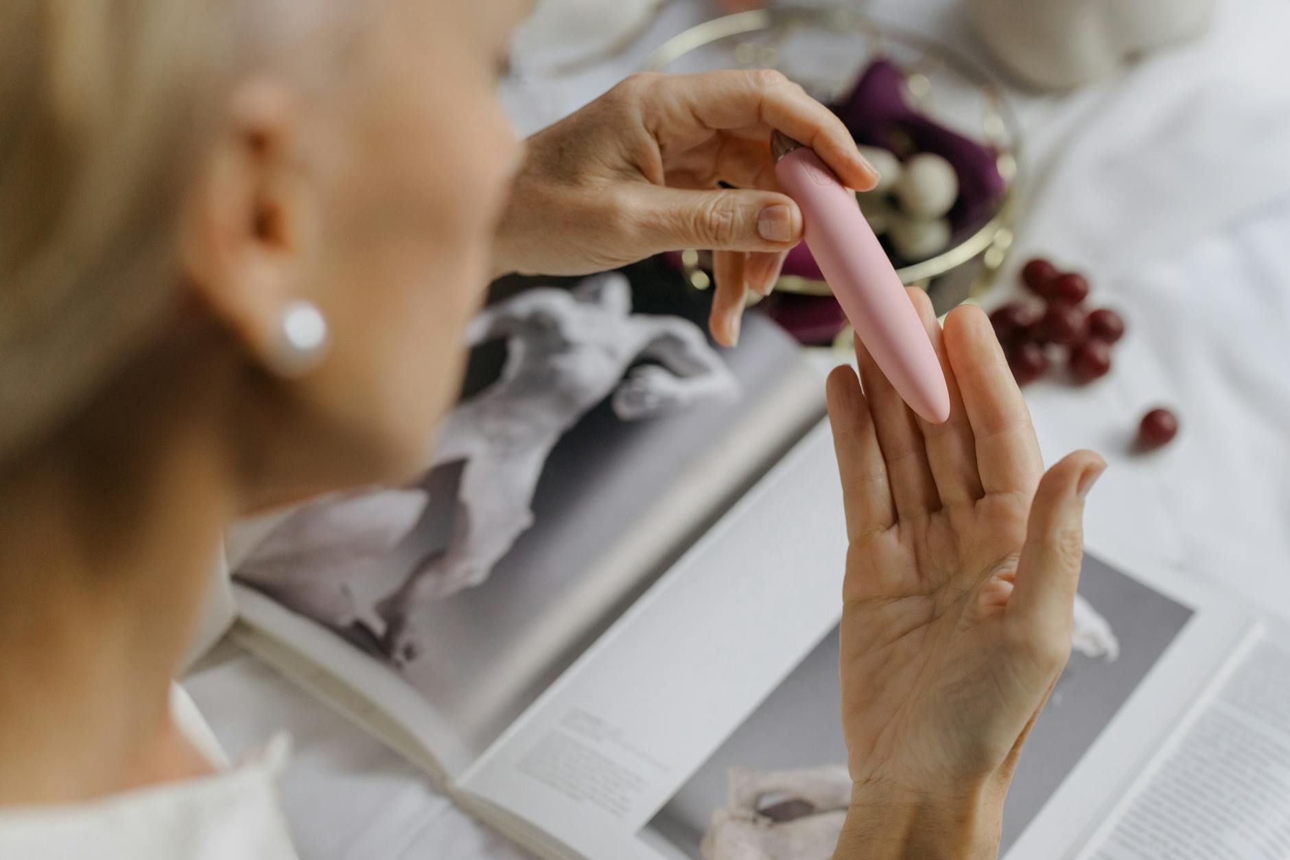 Close-up of hands holding intimate wellness items, symbolizing reconnection and touch after time apart